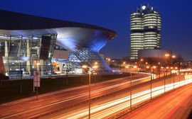 View of the unique architectural design of BWM Welt at night.